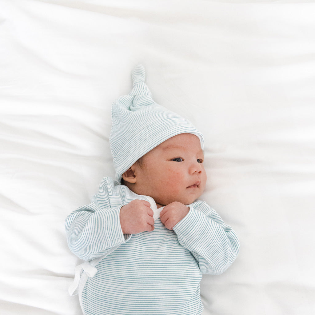 Motherswork x Le Petit Society Baby Organic Knotted Hat in Blue Stripes